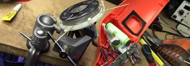 Vacuum cleaner repair parts and tools on a workbench in Denver, CO